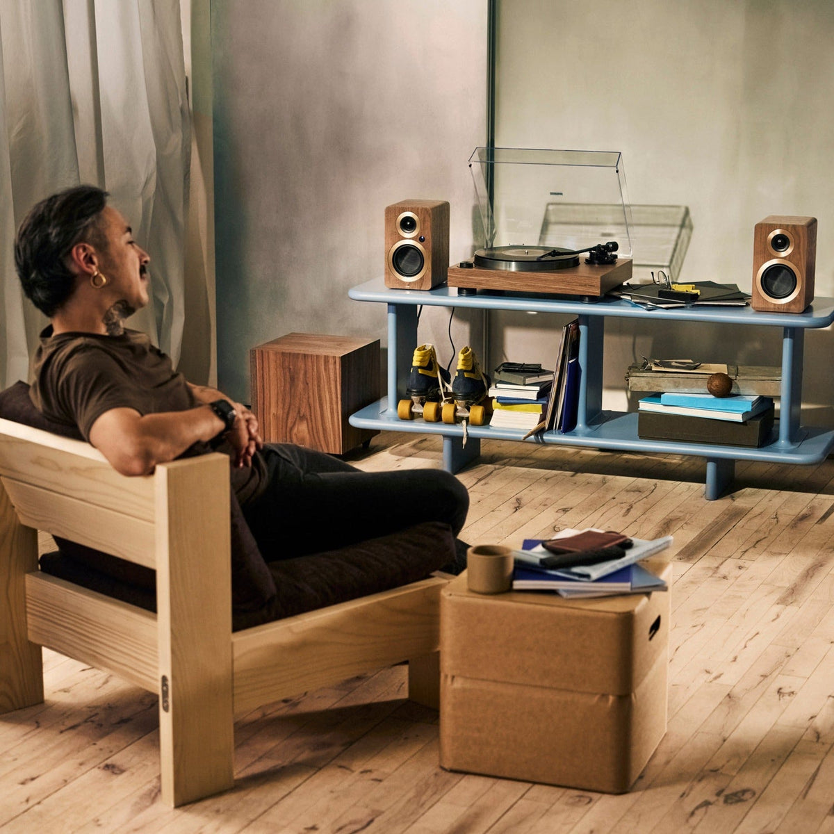 Argon Audio AURORA turntable in walnut in a living room with Argon speakers