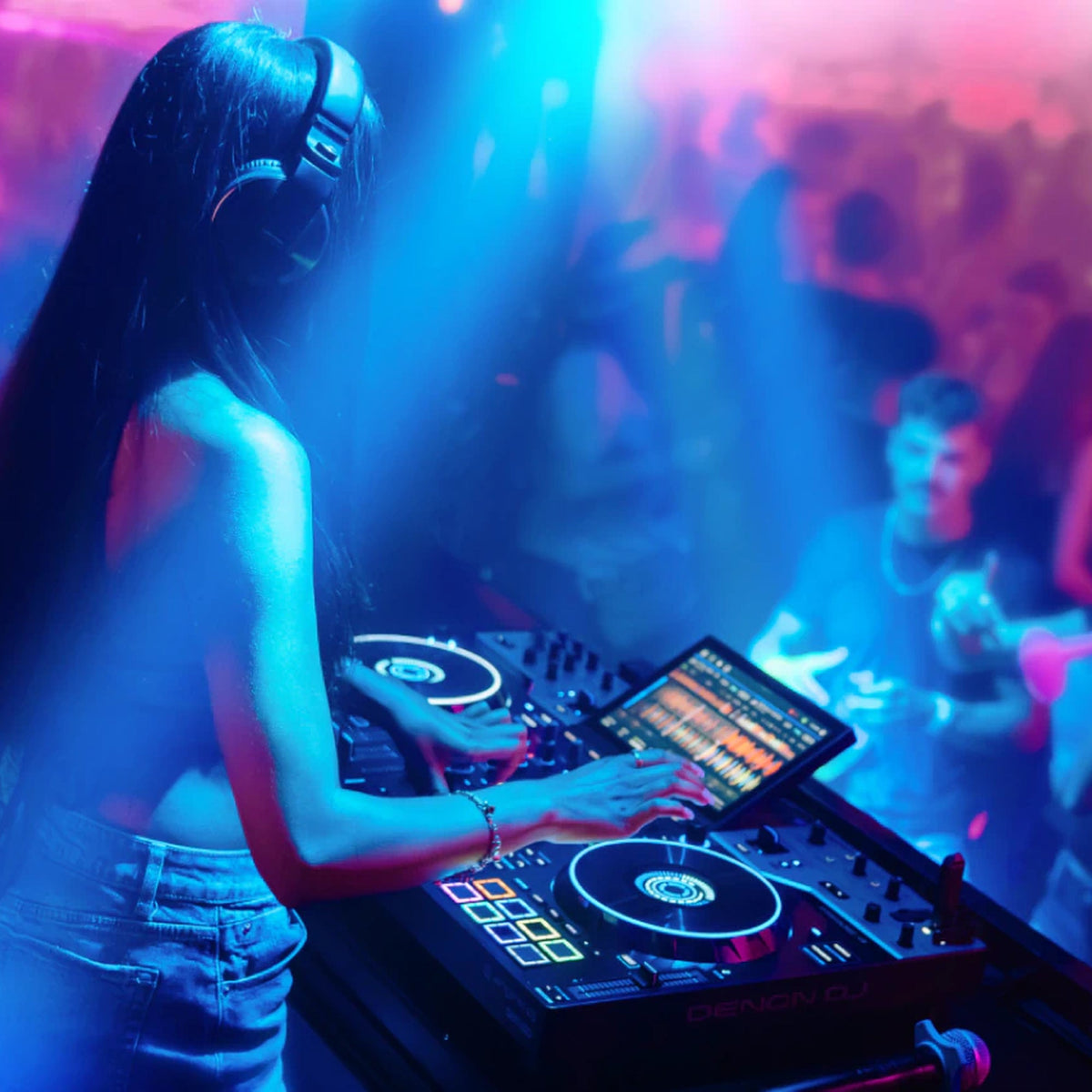 DJ playing a club set on the Denon DJ Prime 4 G2 in front of a crowd