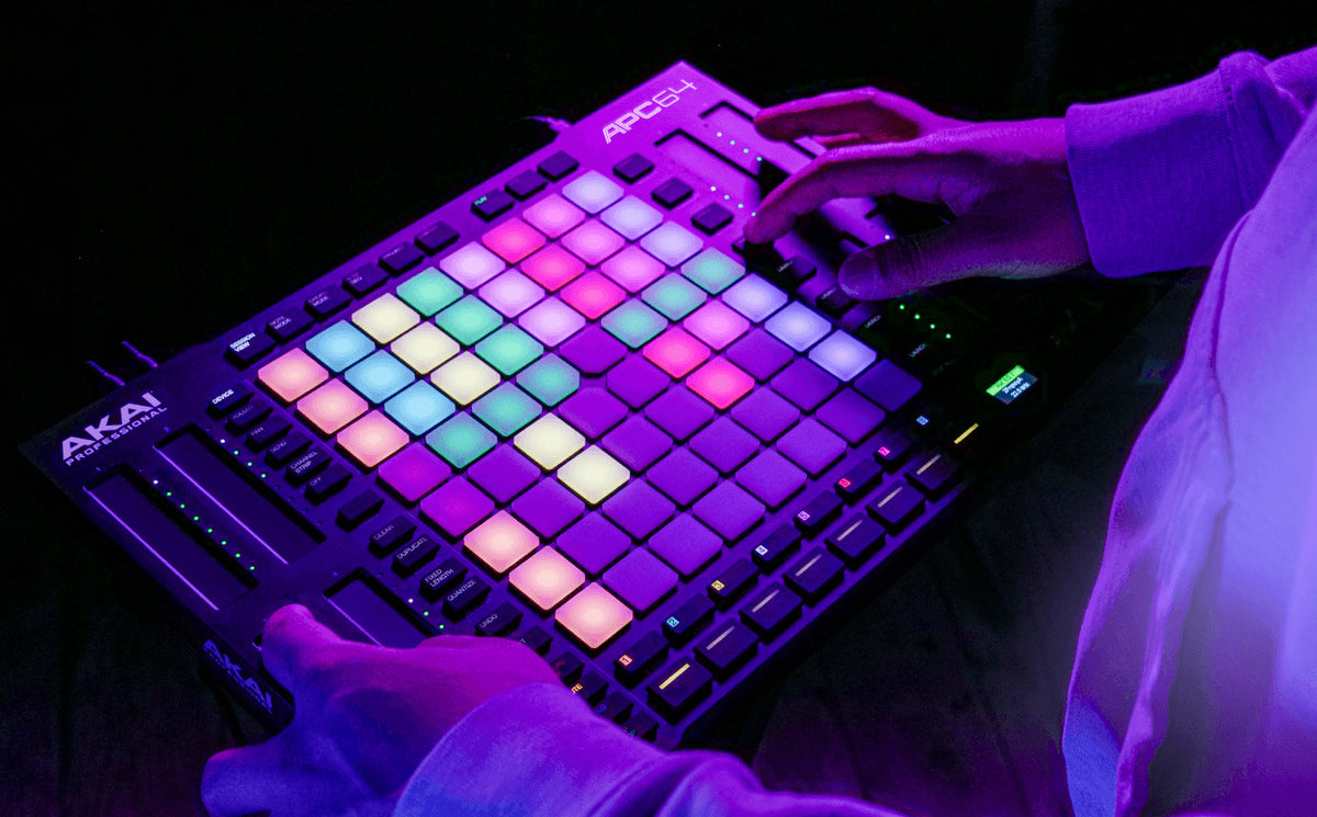 Akai Professional APC64 MIDI controller with grid of 64 colorful pads and control knobs for music production and performance.