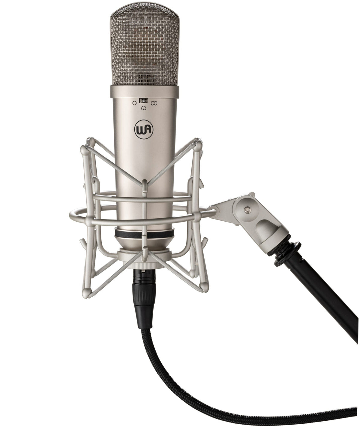 Warm Audio WA-87jr condenser microphone with nickel finish mounted on a shock mount, showing its professional studio recording setup.
