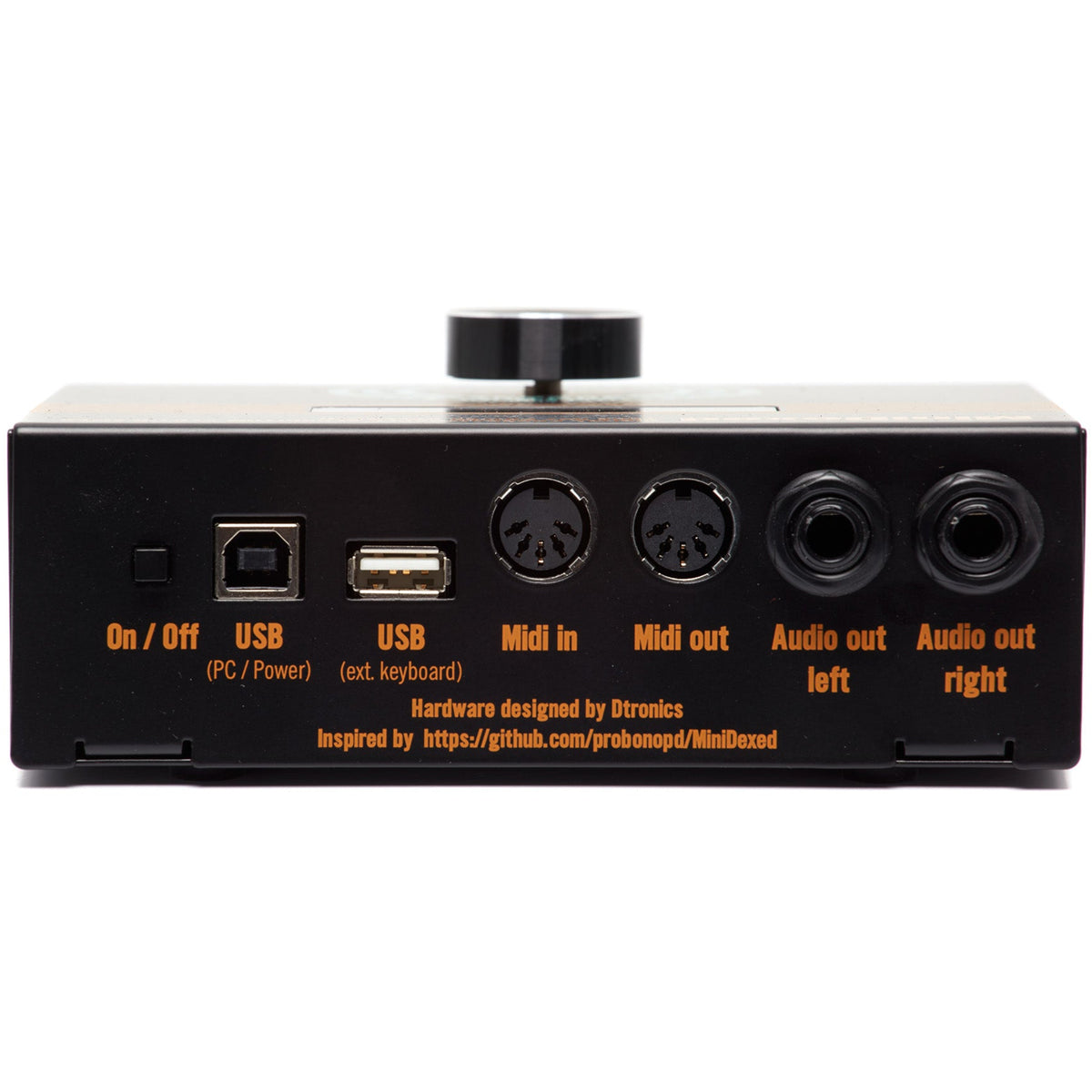 Dtronics DT-DX synthesizer with compact design, featuring knobs, keys, and interface for creating electronic music.