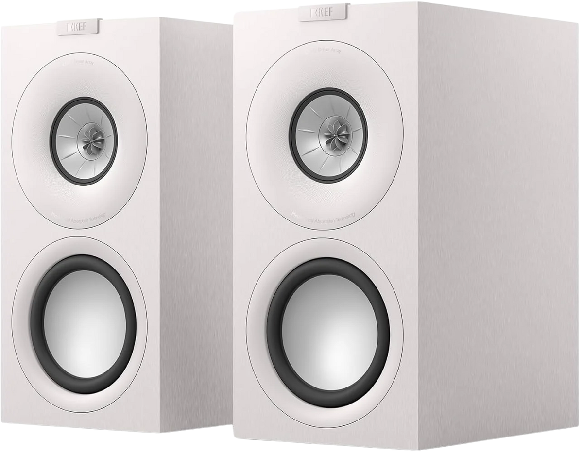 KEF Q Concerto Meta passive bookshelf speakers shown in a stylish home setup, highlighting their sleek design and compact size.