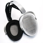HiFiMAN Edition XV wired open-back planar magnetic headphones with black ear cups and headband, resting on a surface.