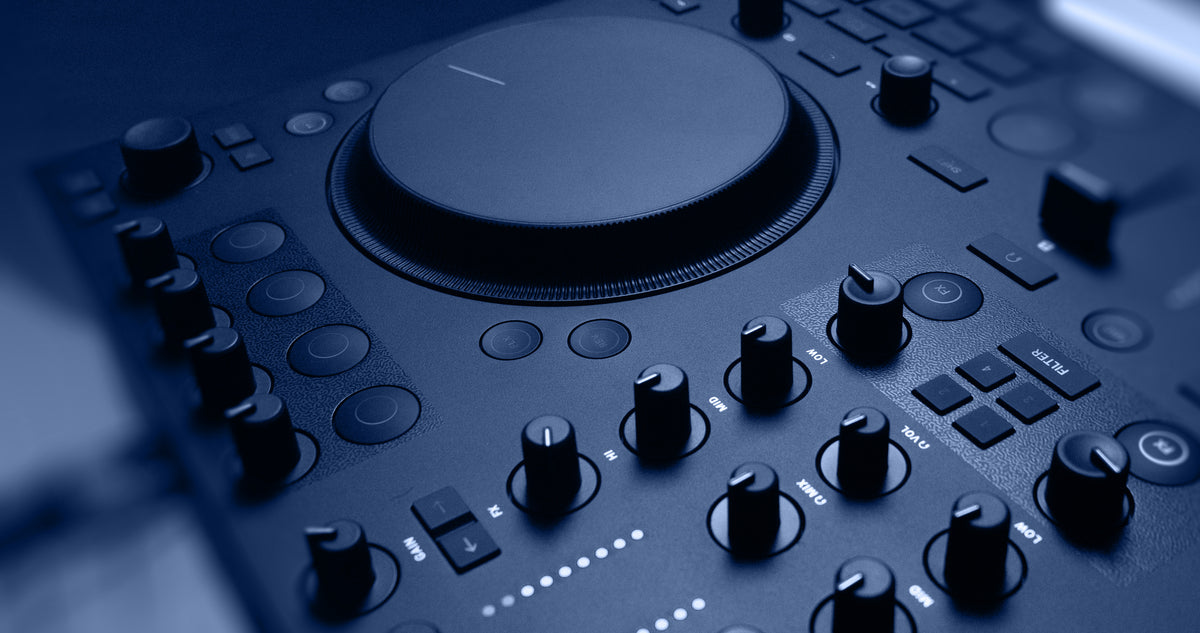 Native Instruments Traktor MX2 DJ controller with dual jog wheels, mixer knobs, and performance pads for digital DJing.