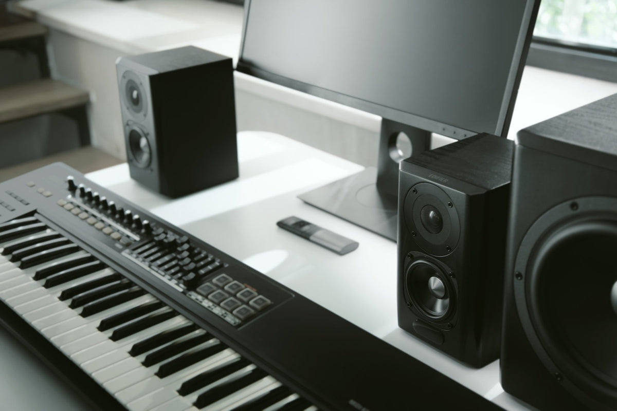 Pair of Edifier S351DB desktop speakers with a subwoofer, featuring wood finish and modern design for home audio setup.