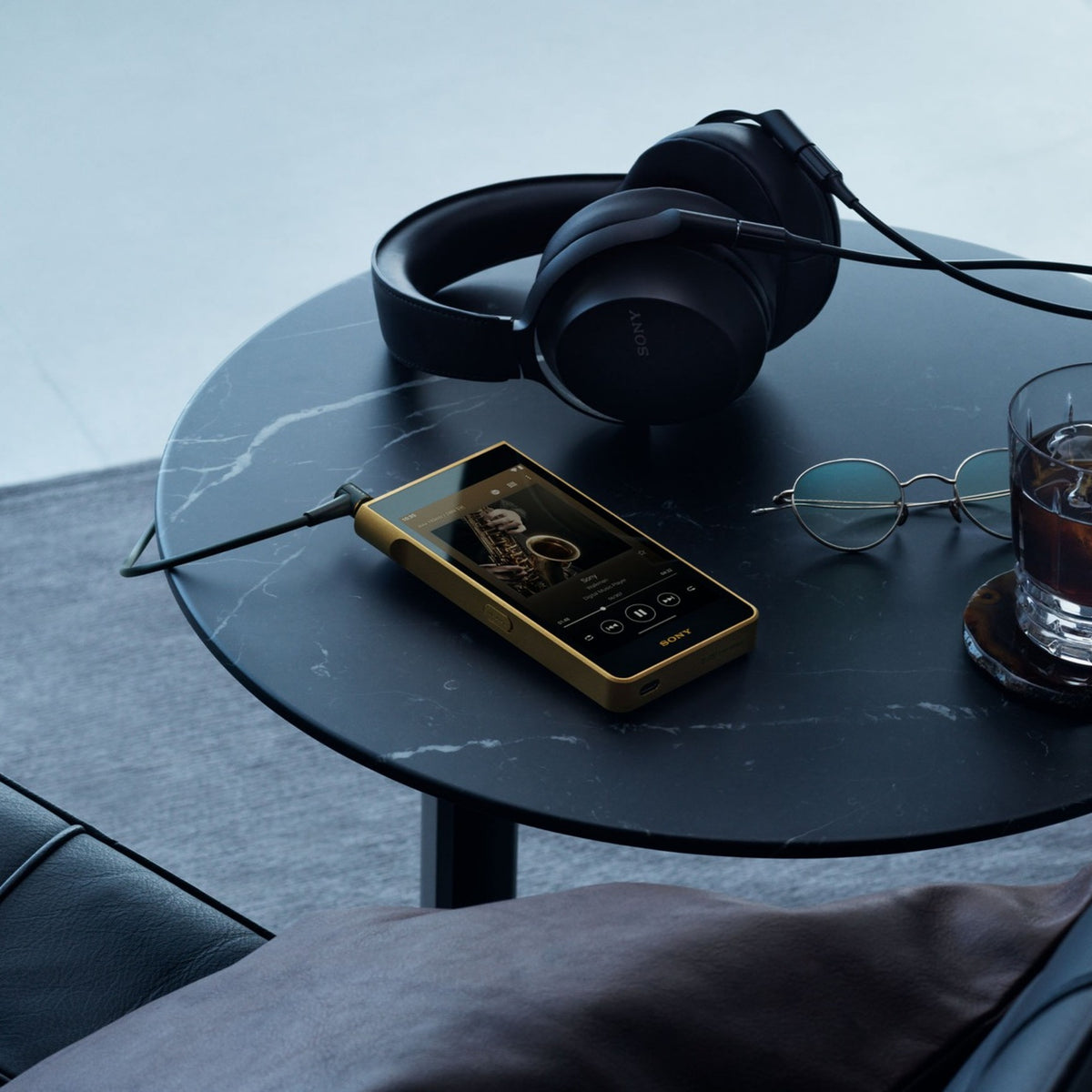 Sony NW-WM1ZM3 Walkman, on a black marble table with headphones